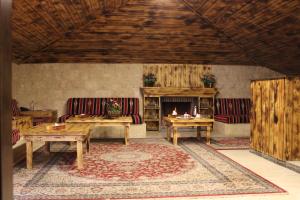 a living room with couches and a fireplace at Reston Hotel in Jounieh