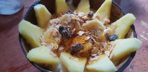 a bowl of food with nuts on top at Water to Forest Ecolodge in Loboc