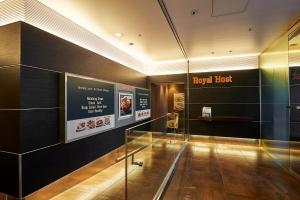 a lobby with a glass floor in a building at Sotetsu Fresa Inn Higashi Shinjuku in Tokyo