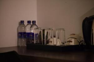 a shelf filled with bottles and bottles of alcohol at City Hotel Colombo 02 in Colombo