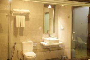 a bathroom with a toilet and a sink at City Hotel Colombo 02 in Colombo