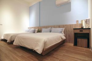 Postelja oz. postelje v sobi nastanitve Haichin&Haiting B&B