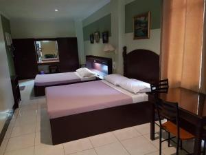 Postel nebo postele na pokoji v ubytování ROLET HOTEL