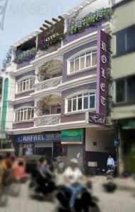 a building with people sitting in front of it at ROLET HOTEL in Catbalogan