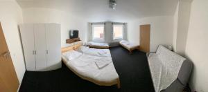 Postel nebo postele na pokoji v ubytování Apartmány Viktorka