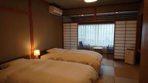 Voodi või voodid majutusasutuse Sundance Resort Hakone Gora toas
