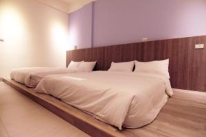 Postelja oz. postelje v sobi nastanitve Haichin&Haiting B&B