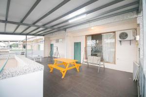 a patio with a table and chairs on a house at Wenxin Homestay in Hualien City
