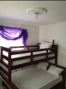 two bunk beds in a room with a window at Total New!! Exclusive!! Apt At Paradise V .. in Santo Domingo