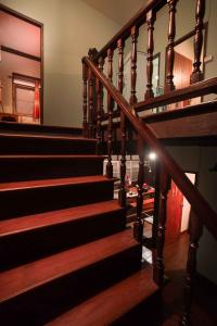 a staircase in a house with a light on it at Yesterday Sathon in Bangkok