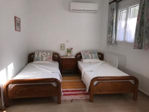 Posteľ alebo postele v izbe v ubytovaní Schönes Familienappartement in Pelekas, Corfu mit Meerblick