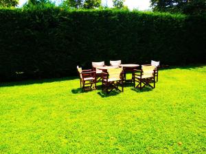 a table and chairs in a field of grass at Villa Riviera in Stavros