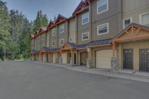a large apartment building with a parking lot at Collins Lake #112 in Government Camp