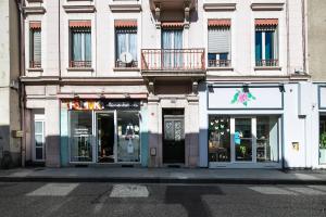 a building on a city street with a store at le cocon voironnais in Rives