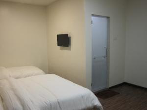 Postel nebo postele na pokoji v ubytování Setia Inn
