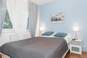 Posteľ alebo postele v izbe v ubytovaní Jantar Apartamenty- Zielone Tarasy