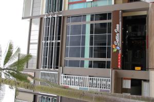 a building with a sign on the side of it at Setia Inn in Shah Alam