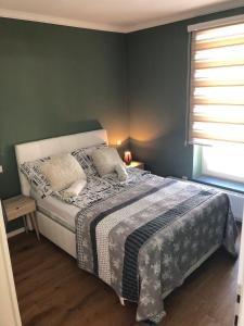 Postel nebo postele na pokoji v ubytování Apartman 01