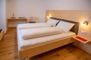 Postel nebo postele na pokoji v ubytování B&B Frühlingsheim