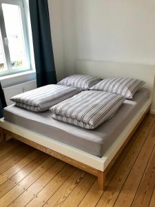 Кровать или кровати в номере Ferienapartment Warnemünde 2