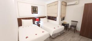 Krevet ili kreveti u jedinici u okviru objekta Hanoi Endless Hotel