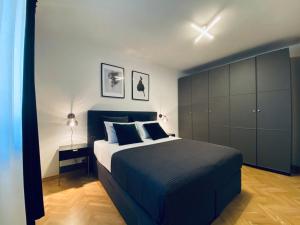 En eller flere senge i et værelse på Cirjak Apartments