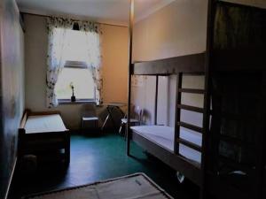 a room with two bunk beds and a window at Songesand Camp in Songesand