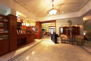 a lobby of a pharmacy with a table and chairs at Boutique Hotel Korana Srakovcic in Karlovac +59 photos