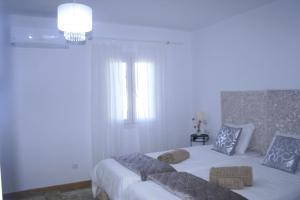Ein Bett oder Betten in einem Zimmer der Unterkunft SWEET HOUSE