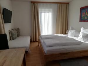 Postel nebo postele na pokoji v ubytování Haus Matt