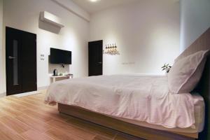 Postelja oz. postelje v sobi nastanitve Haichin&Haiting B&B