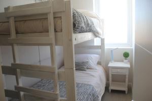 Uma cama ou camas num quarto em Concón Costa de Montemar Departamento, 3 dormitorios