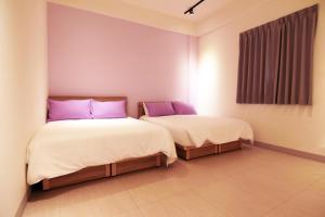 Postelja oz. postelje v sobi nastanitve Haichin&Haiting B&B