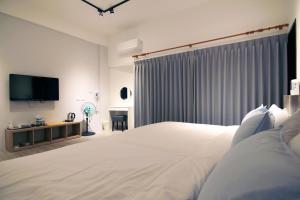 Postelja oz. postelje v sobi nastanitve Haichin&Haiting B&B