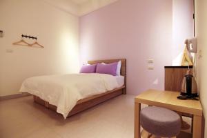 Postelja oz. postelje v sobi nastanitve Haichin&Haiting B&B