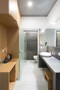 a bathroom with a sink and a toilet at TCZ Woźna in Poznań +27 photos