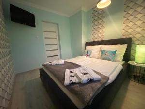 Posteľ alebo postele v izbe v ubytovaní Blue Sky Apartament