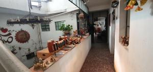 a store with a counter with many items on it at Hotel Posada Spa Antigua Casa Hogar in Taxco de Alarcón
