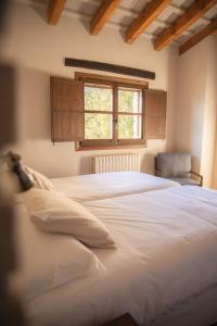 Postel nebo postele na pokoji v ubytování Mas de l'Arlequi