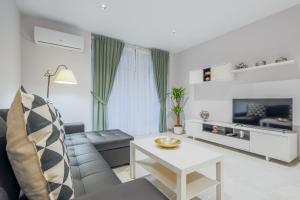 Televízia a/alebo spoločenská miestnosť v ubytovaní EXCLUSIVO APT 2 HAB-2 BAÑOS-LUMINOSO ↑ CALIDADES