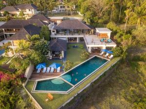 an aerial view of a house with a swimming pool at Villa Aamisha in Candidasa