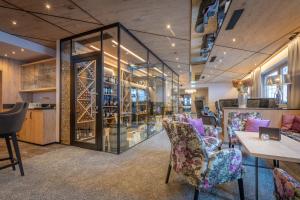 a wine tasting room with chairs and a table at Der Rindererhof in Tux