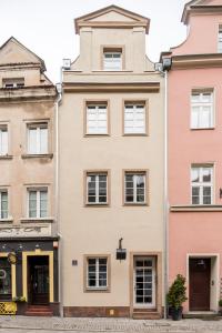 a row of buildings in a city at TCZ Woźna in Poznań