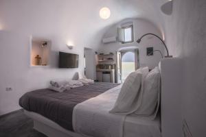 Postel nebo postele na pokoji v ubytování Cupola Suites + 37 fotografií