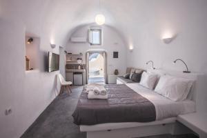 Voodi või voodid majutusasutuse Cupola Suites toas