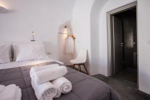 Voodi või voodid majutusasutuse Cupola Suites toas