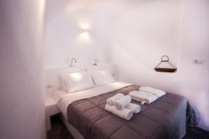 Voodi või voodid majutusasutuse Cupola Suites toas