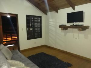 TV a/nebo společenská místnost v ubytování Villa Laura Jarabacoa