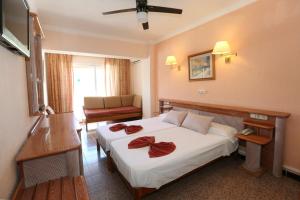 Łóżko lub łóżka w pokoju w obiekcie Hotel Manaus