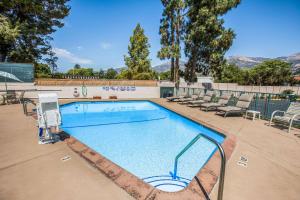 a large swimming pool with chairs at Quality Inn Santa Barbara in Santa Barbara